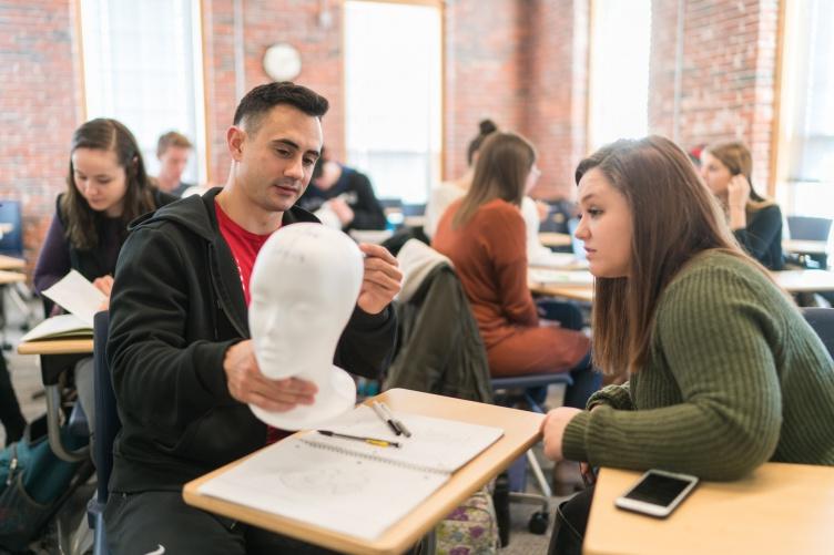 Neuropsychology students at UNH Manchester studying brain anatomy in psychobiology class